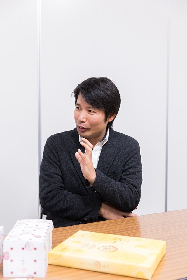 観覧車方式のたい焼き機にたどり着くまでに数年かかったと語る有光さん<br>